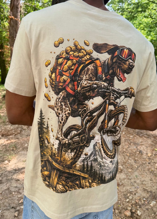 Person wearing a t-shirt with a graphic design of a person on a bike and a helmet.